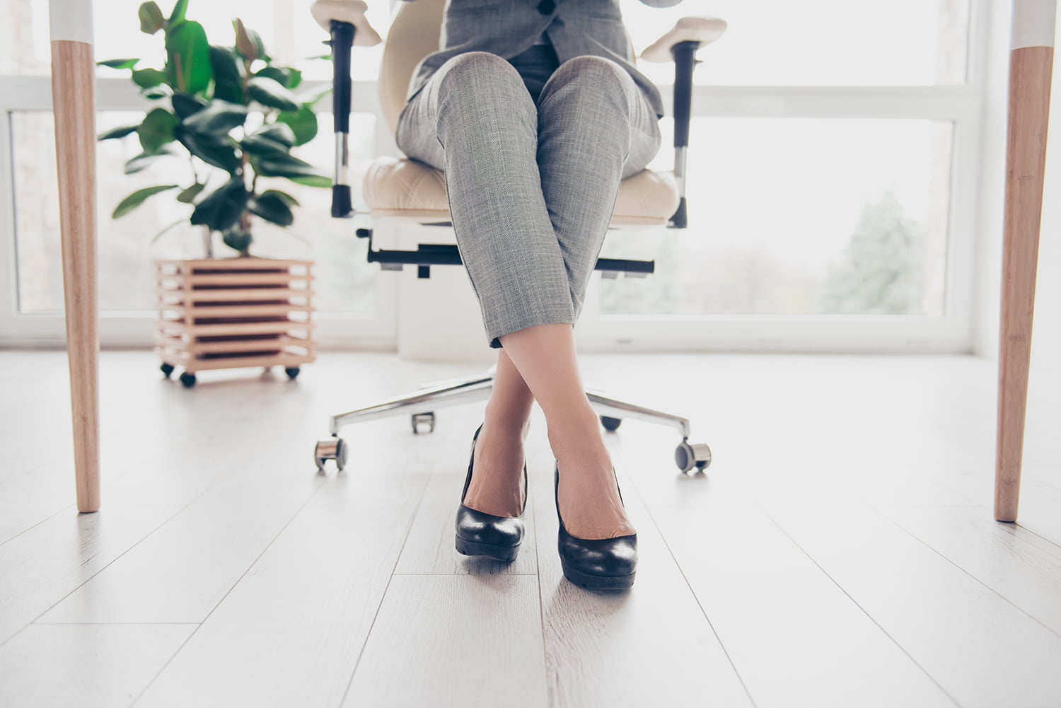 Woman with hypertonic pelvic floor dysfunction sitting in a chair
